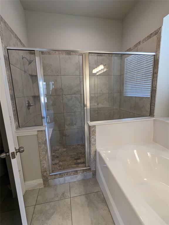 3741 Cecelia Lane Forest Hill, TX 76140 - Photo 9 of 16 a bathroom with a bathtub and a shower