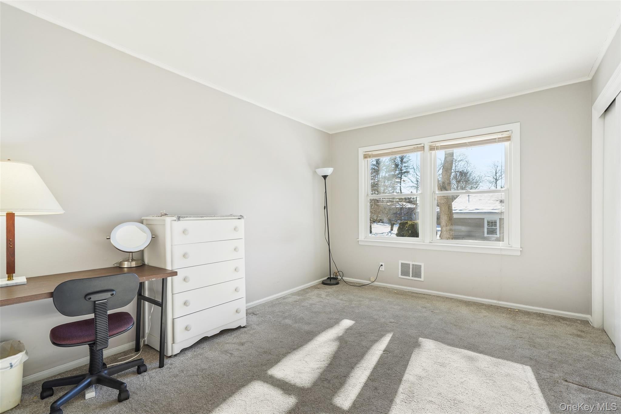 2 Churchill Road Rye Brook, NY 10573 - Photo 14 of 22 a bedroom with furniture and a window