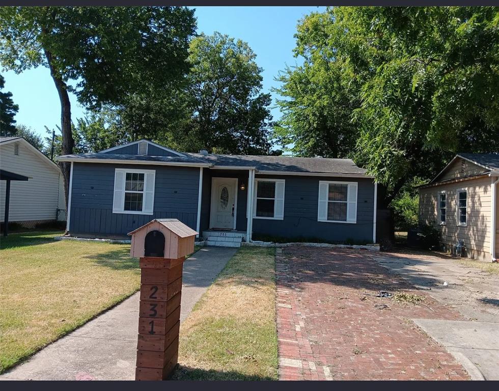 231 Elm Street Hurst, TX 76053 - Photo 2 of 11 a front view of house with yard outdoor seating and barbeque oven