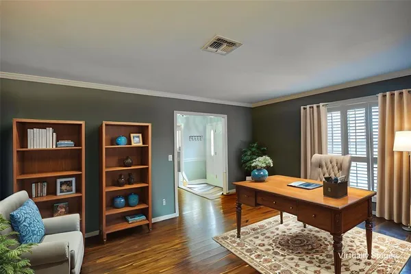 a living room with furniture couch and window