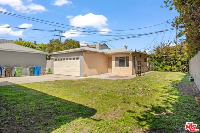 a view of a big yard with potted plants