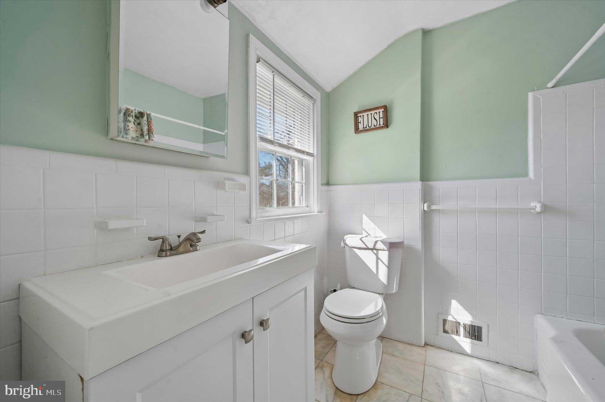 114 Providence Road Morton, PA 19070 - Photo 17 of 25 a bathroom with a sink mirror and toilet