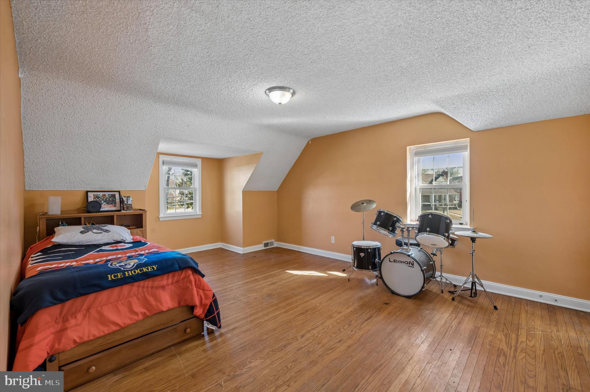 114 Providence Road Morton, PA 19070 - Photo 18 of 25 a bedroom with a bed and wooden floor