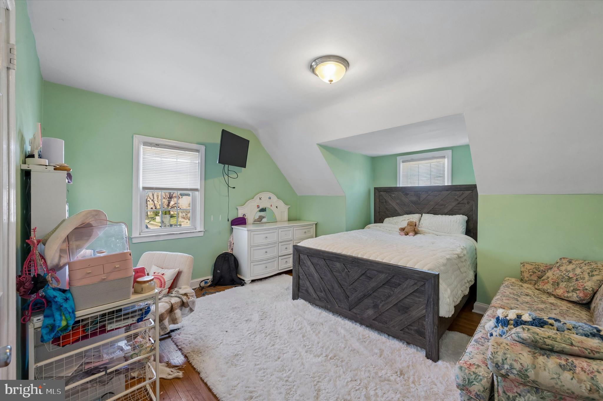 114 Providence Road Morton, PA 19070 - Photo 19 of 25 a bedroom with a bed and a tv