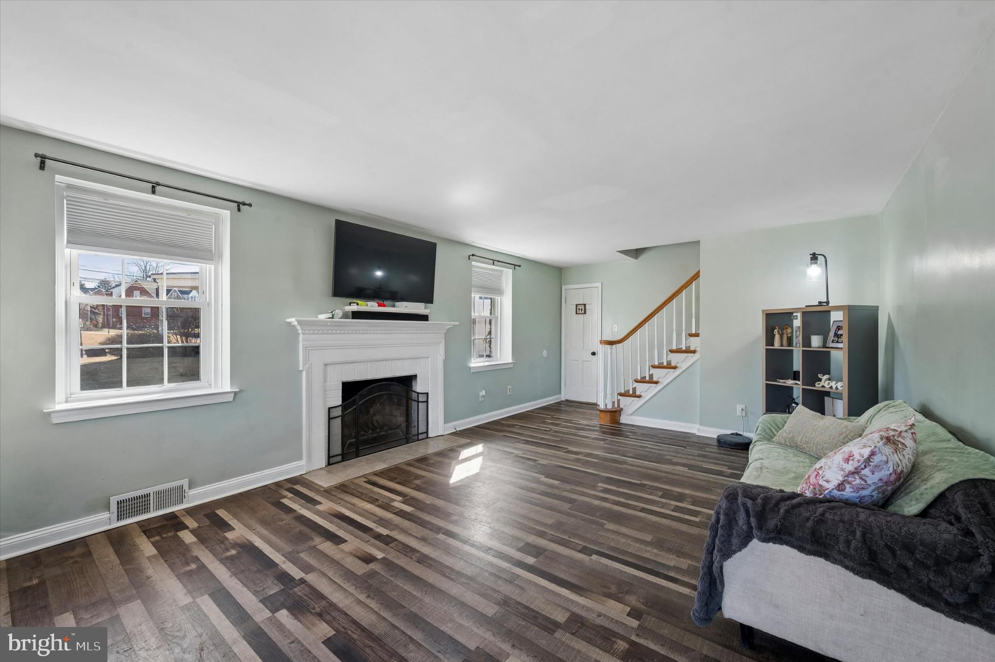114 Providence Road Morton, PA 19070 - Photo 2 of 25 a living room with furniture and a fireplace
