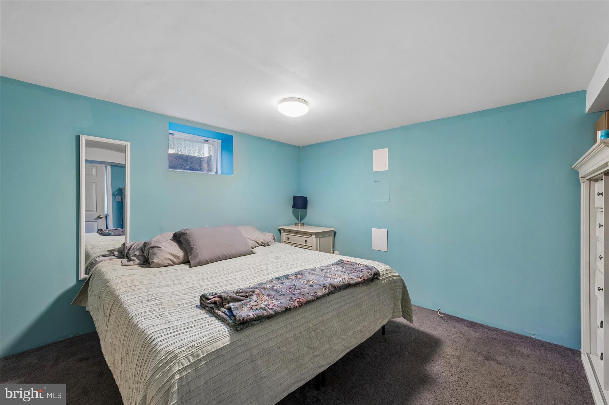 114 Providence Road Morton, PA 19070 - Photo 22 of 25 a bedroom with a bed and a night stand