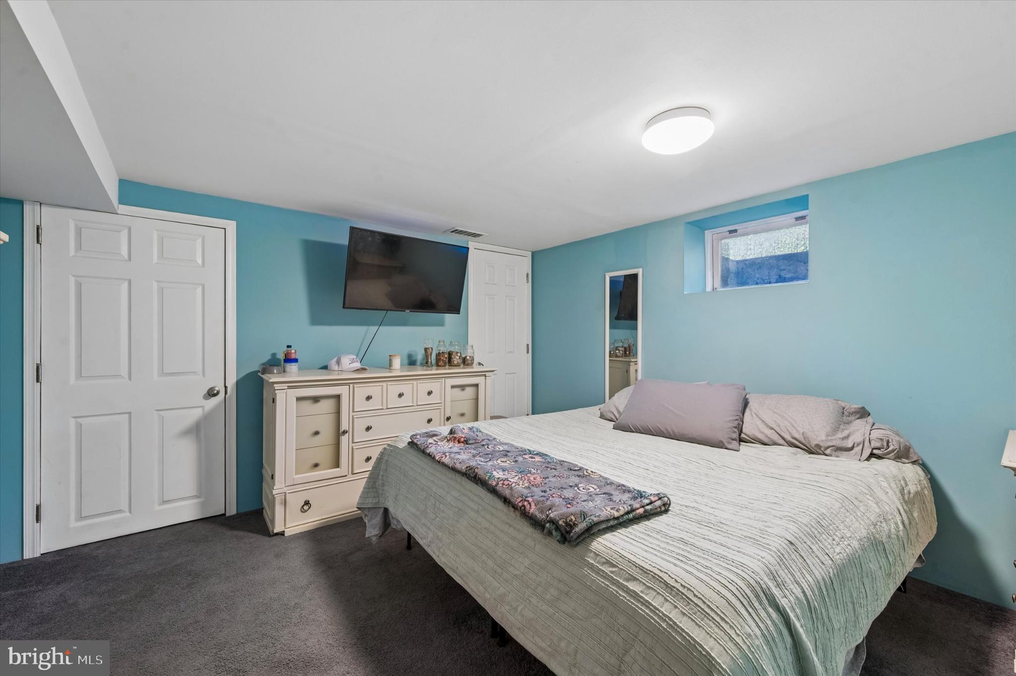 114 Providence Road Morton, PA 19070 - Photo 23 of 25 a bedroom with a bed and a flat screen tv