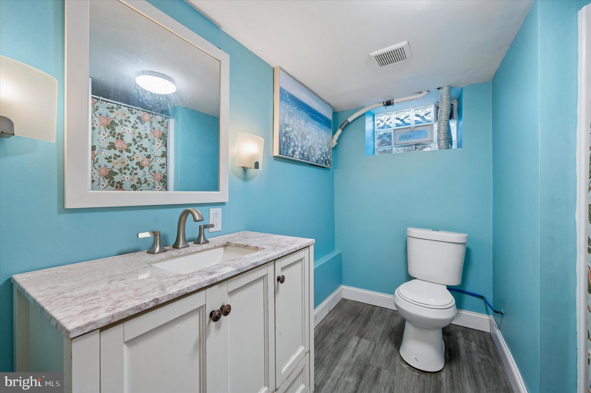 114 Providence Road Morton, PA 19070 - Photo 24 of 25 a bathroom with a toilet sink and mirror