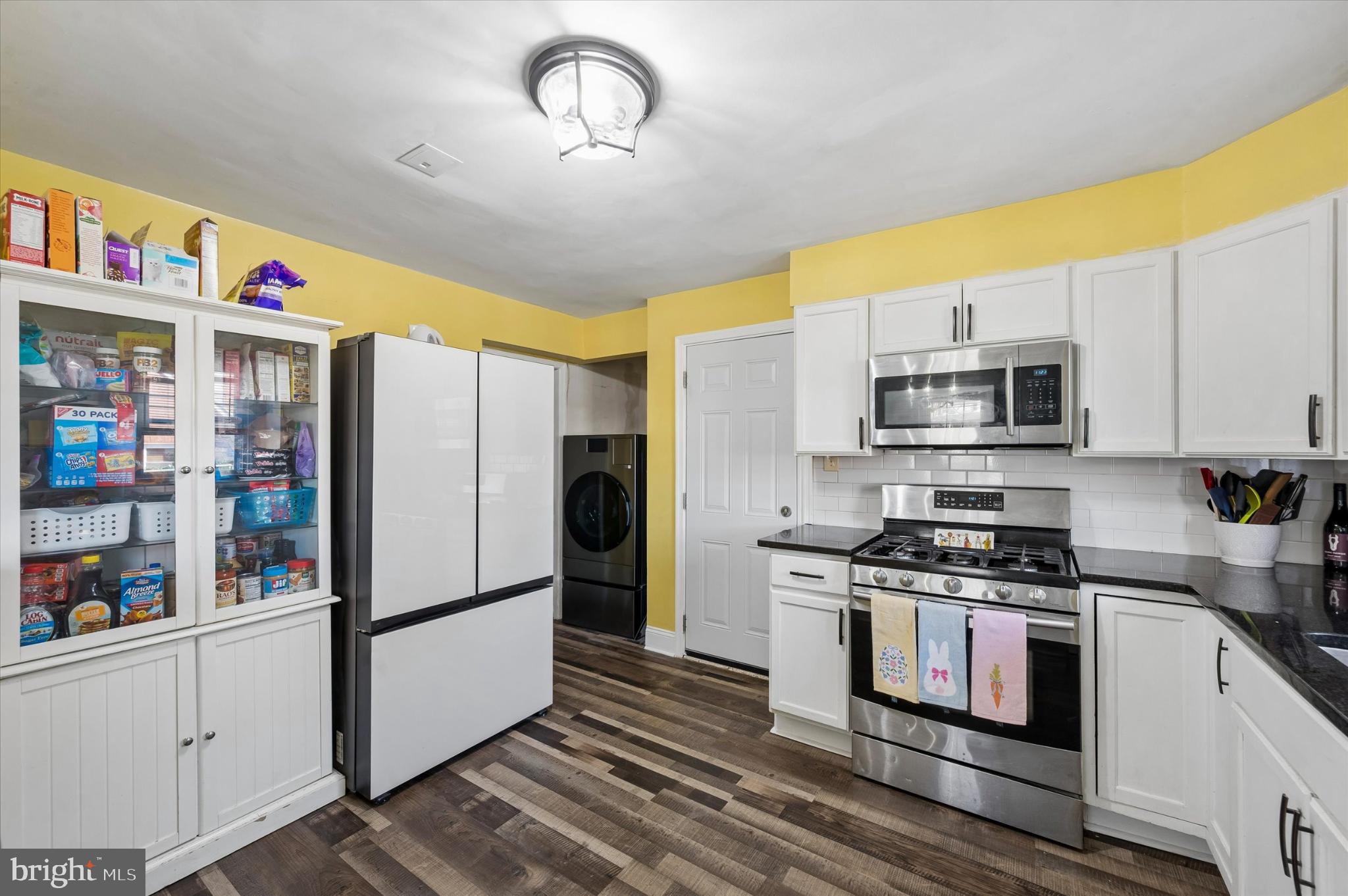 114 Providence Road Morton, PA 19070 - Photo 9 of 25 a kitchen with stainless steel appliances granite countertop a refrigerator a stove and a sink