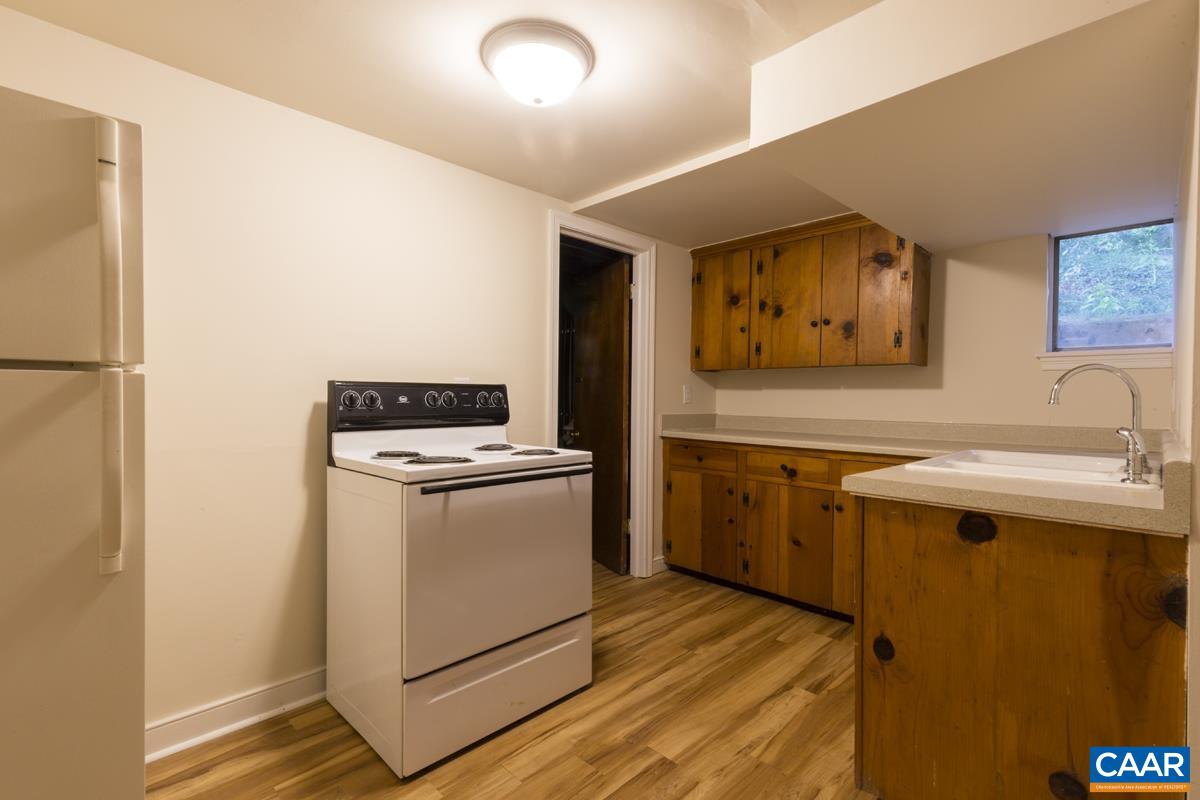 821 Cabell Avenue, Unit A&B Charlottesville, VA 22903 - Photo 13 of 27 a kitchen with a stove cabinets and a refrigerator