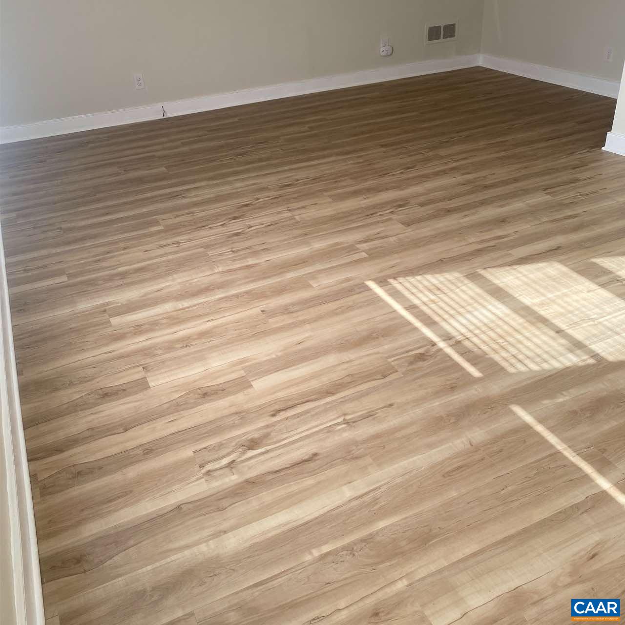 821 Cabell Avenue, Unit A&B Charlottesville, VA 22903 - Photo 15 of 27 a view of a room with wooden floor
