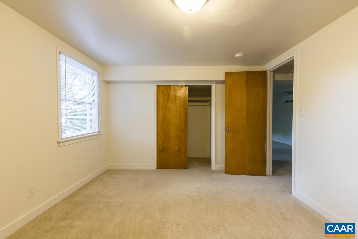 821 Cabell Avenue, Unit A&B Charlottesville, VA 22903 - Photo 16 of 27 a view of an empty room with a window