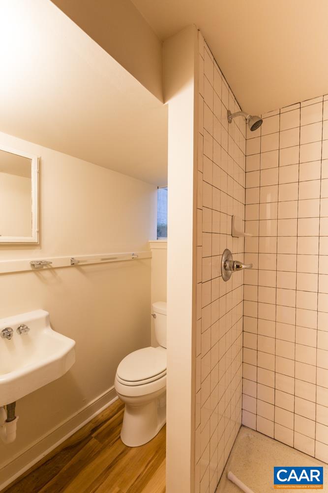 821 Cabell Avenue, Unit A&B Charlottesville, VA 22903 - Photo 17 of 27 a bathroom with a toilet and a shower