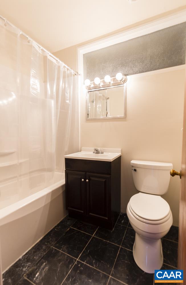 821 Cabell Avenue, Unit A&B Charlottesville, VA 22903 - Photo 18 of 27 a bathroom with a sink toilet and shower