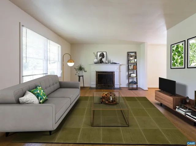 a living room with furniture a flat screen tv and a fireplace