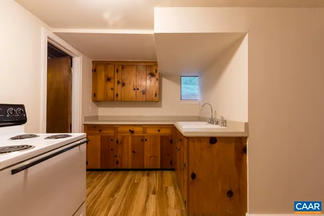 a kitchen with a sink and cabinets