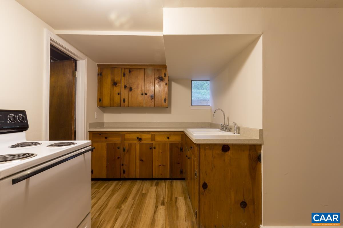 821 Cabell Avenue, Unit A&B Charlottesville, VA 22903 - Photo 22 of 27 a kitchen with a sink and cabinets