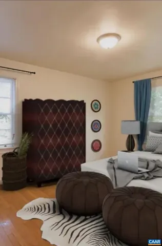 a bedroom with furniture and a lamp