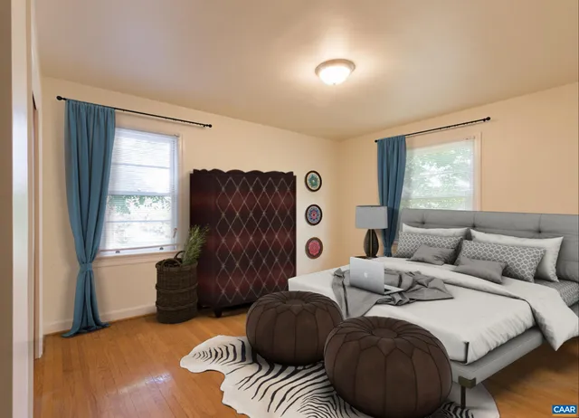 a bedroom with two beds and a window