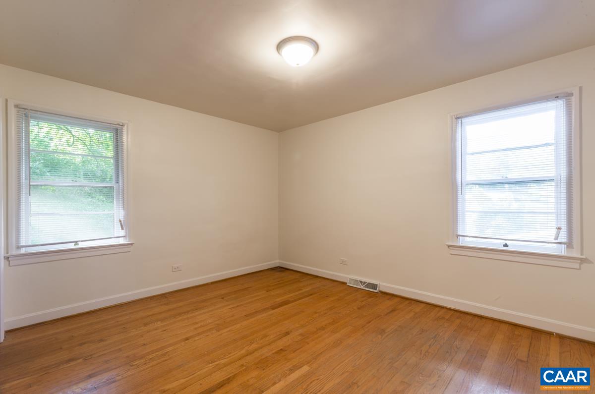 821 Cabell Avenue, Unit A&B Charlottesville, VA 22903 - Photo 8 of 27 an empty room with a window