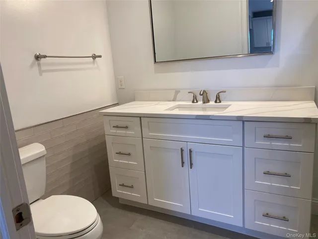 a white refrigerator freezer and a dishwasher with wooden floor