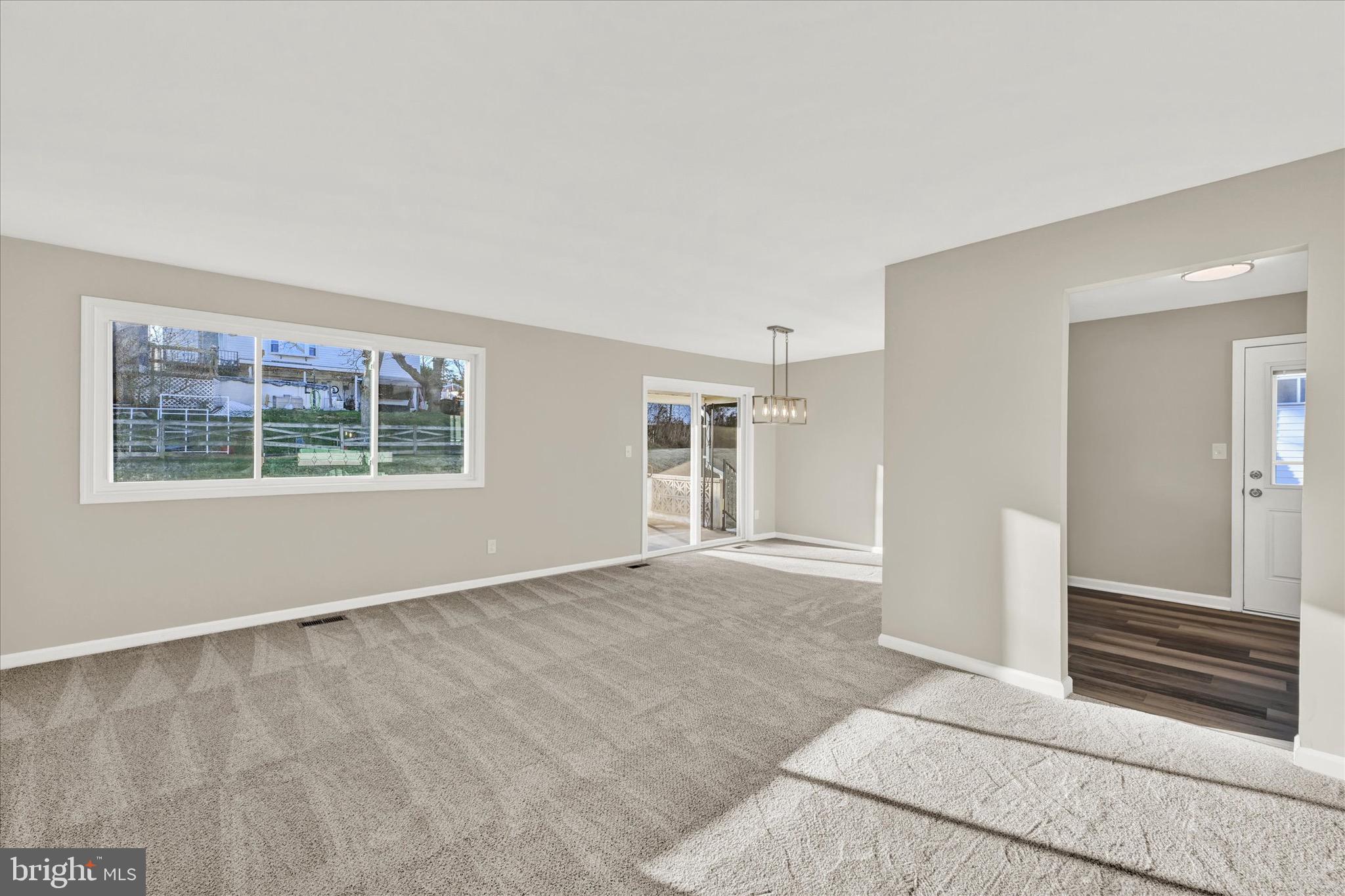8117 Callo Lane Rosedale, MD 21237 - Photo 6 of 23 a view of an empty room with a window