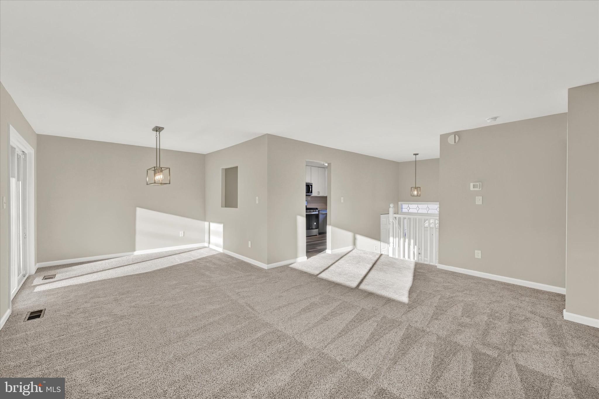 8117 Callo Lane Rosedale, MD 21237 - Photo 7 of 23 a view of an empty room with cabinet and entryway