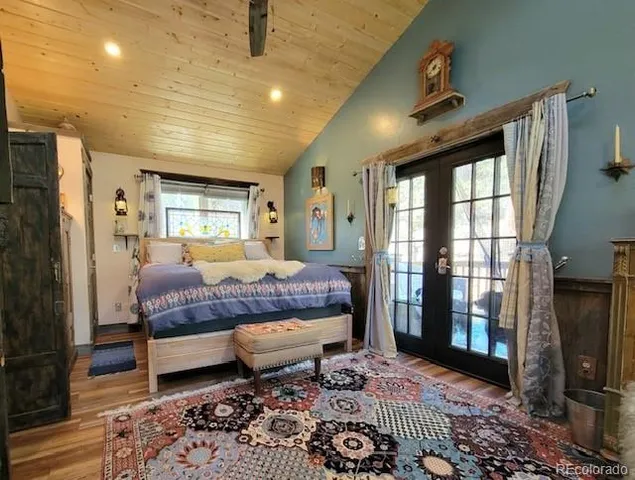 a bed room with a bed and glass door