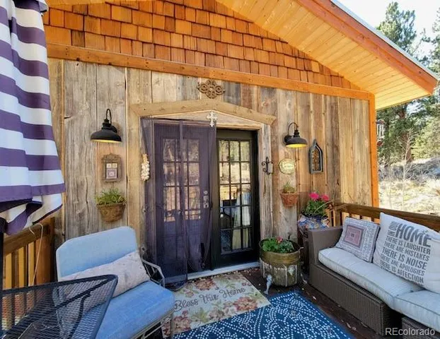 a outdoor space with patio couch and a potted plant