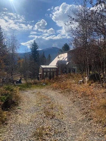 a backyard of a house with a yard and garage