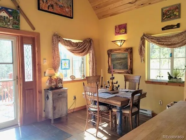 a dining room with furniture and window