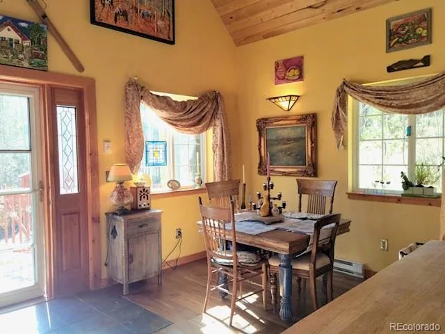 a dining room with furniture and window