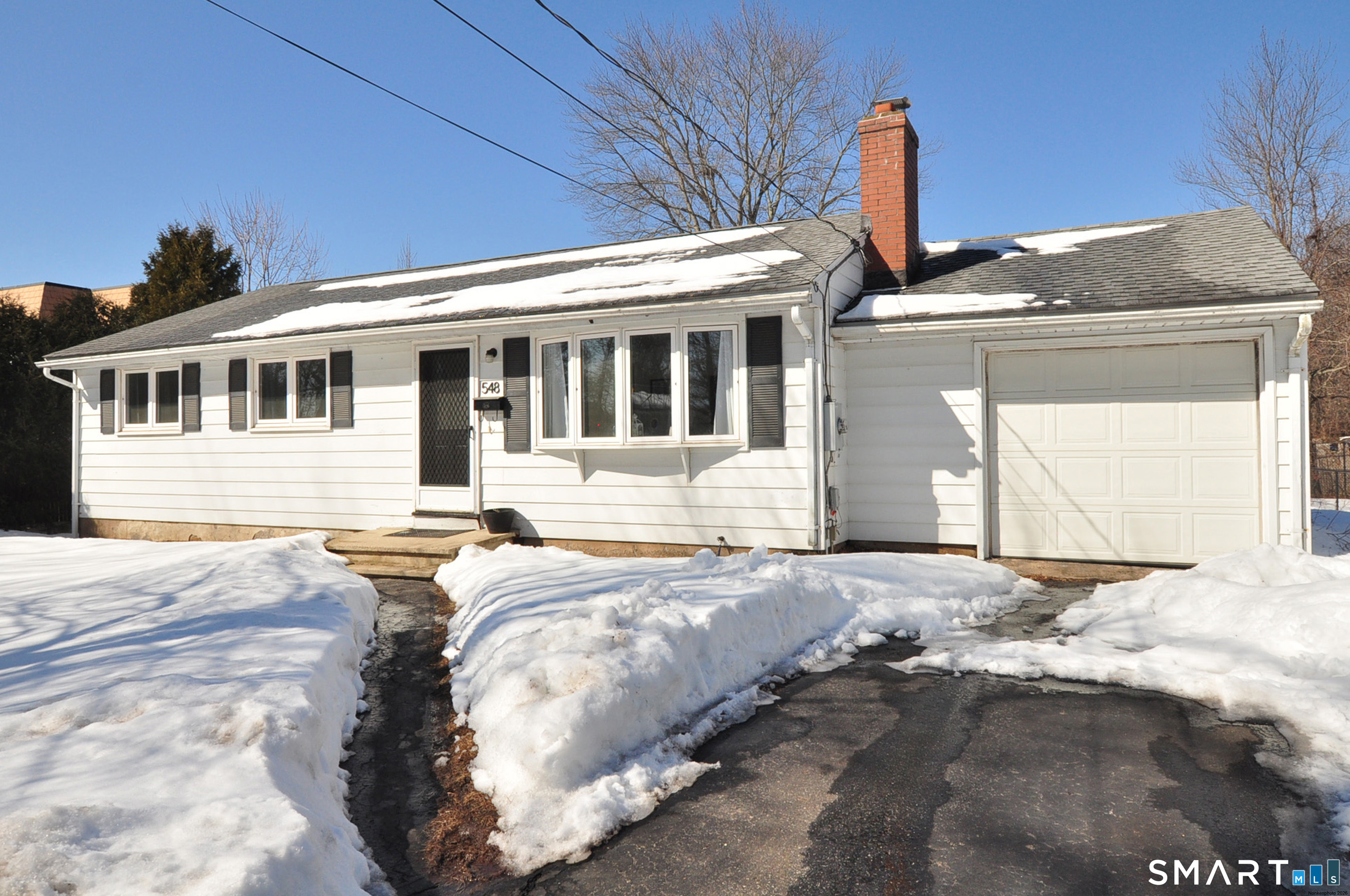 a front view of a house with yard