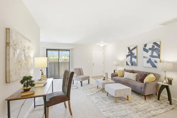 a view of a big yard with plants and a fountain