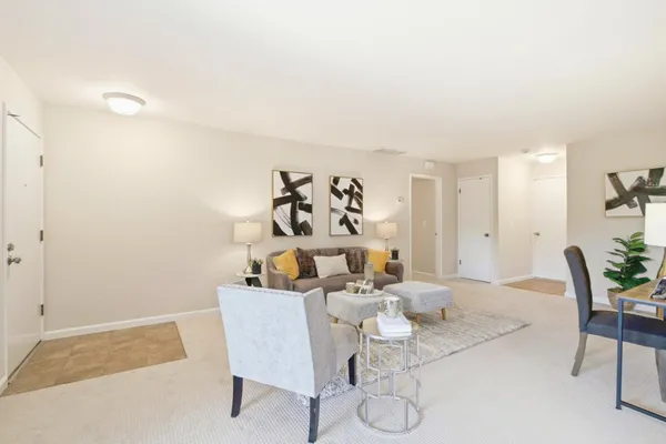 a view of a house with a yard porch and sitting area