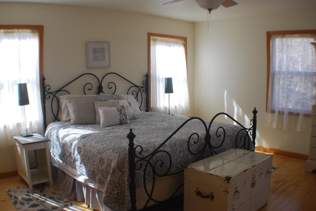 1013 Buck Ridge Drive Murphy, NC 28906 - Photo 23 of 34 a bedroom with bed and a window