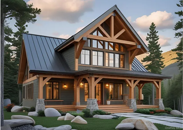 a front view of a house with entryway and a garden