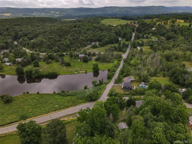 a aerial view of a house with a yard