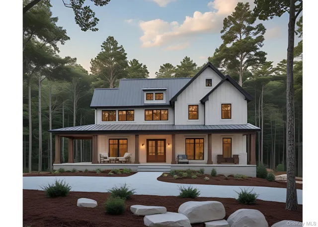 a front view of a house with garden and porch