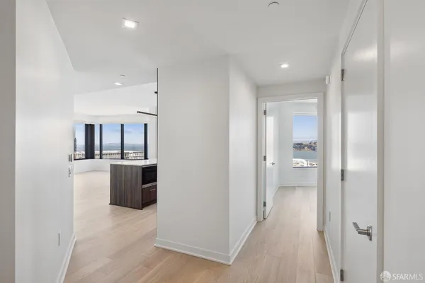 a view of a hallway with dining area