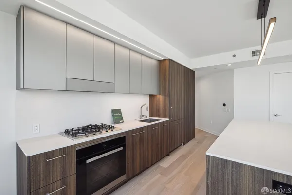 a kitchen with a stove and a refrigerator