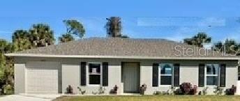a front view of a building with potted plants