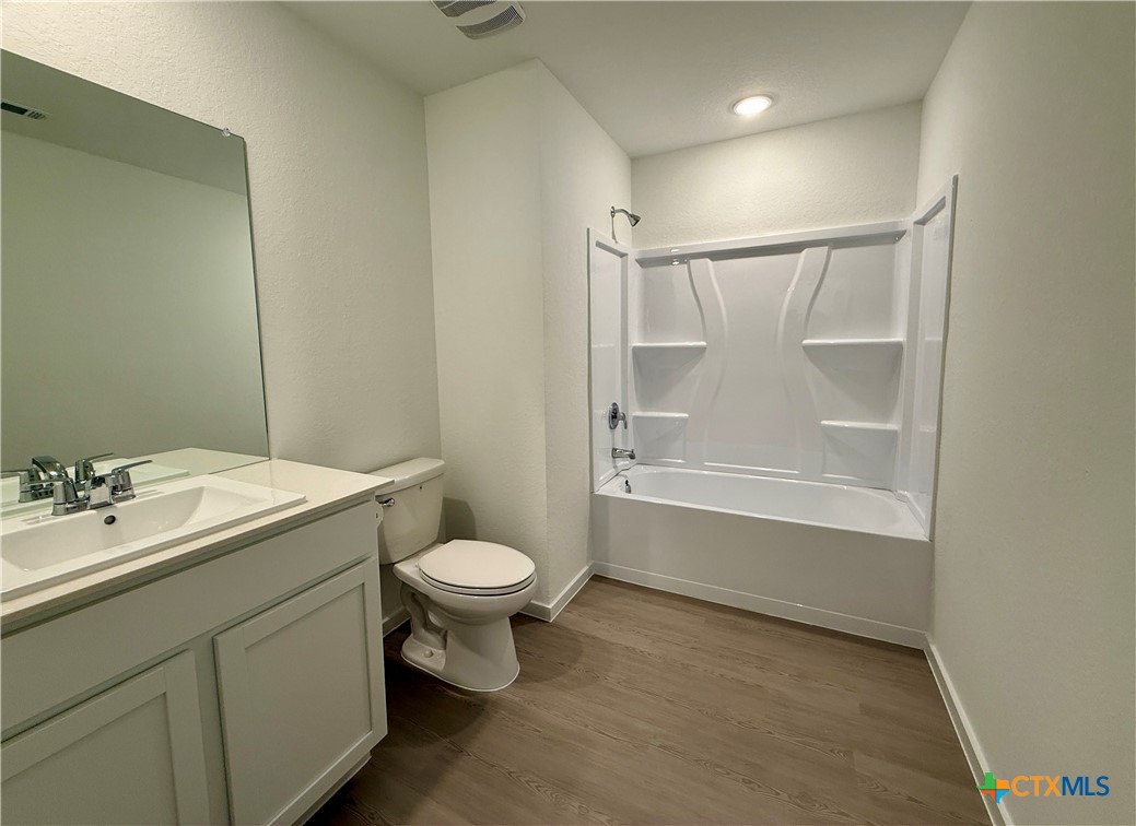 311 Moscato Road New Braunfels, TX 78130 - Photo 29 of 38 a bathroom with a sink toilet and shower