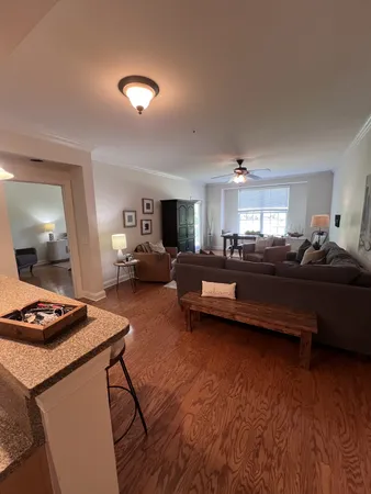 a bedroom with furniture and a wooden floor