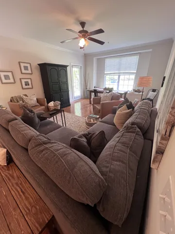 a living room with furniture and a window