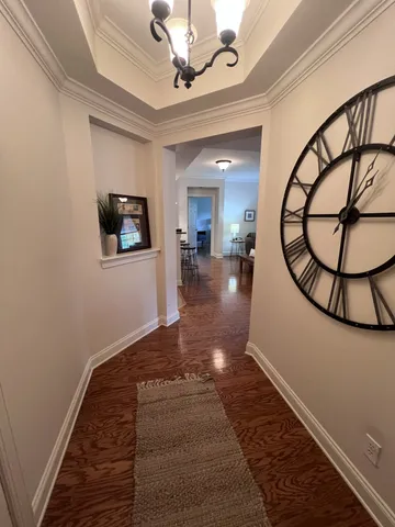 a view of a livingroom with furniture and entryway
