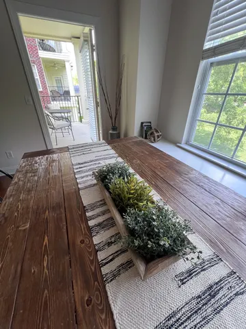 a view of balcony with wooden floor