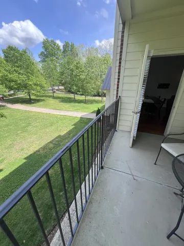 a view of a balcony with an ocean view