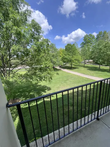 a balcony with an outdoor space