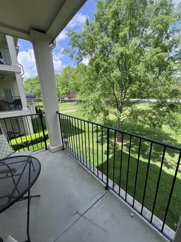 a view of a balcony with chairs